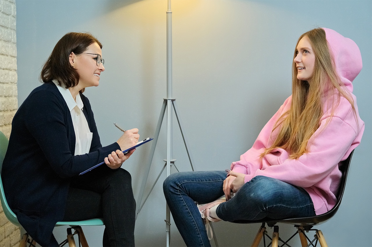 A young person is being interviewed for a job