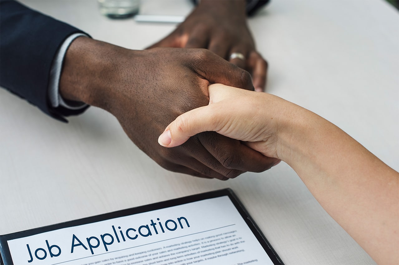 Shaking hands over a job offer under new employment law
